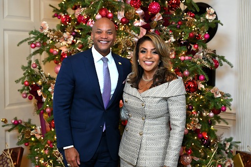 Wes and Dawn Moore in front of a Christmas tree.