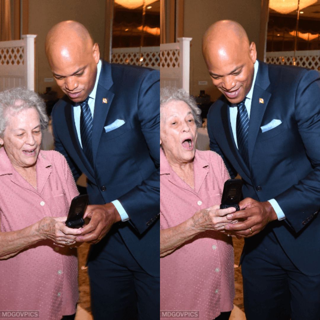 Wes taking a selfie with a Marylander while giving them some help