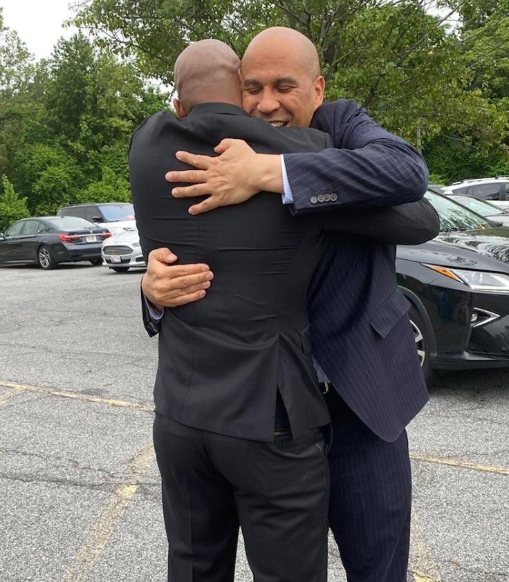 Moore and Booker hugging